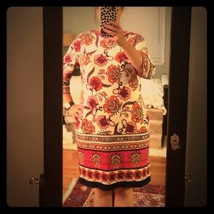 Knit dress with pink floral pattern.